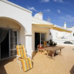 Terrace table and awning